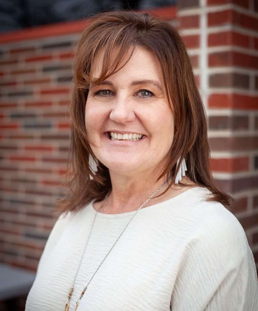 Volunteer and student reading together